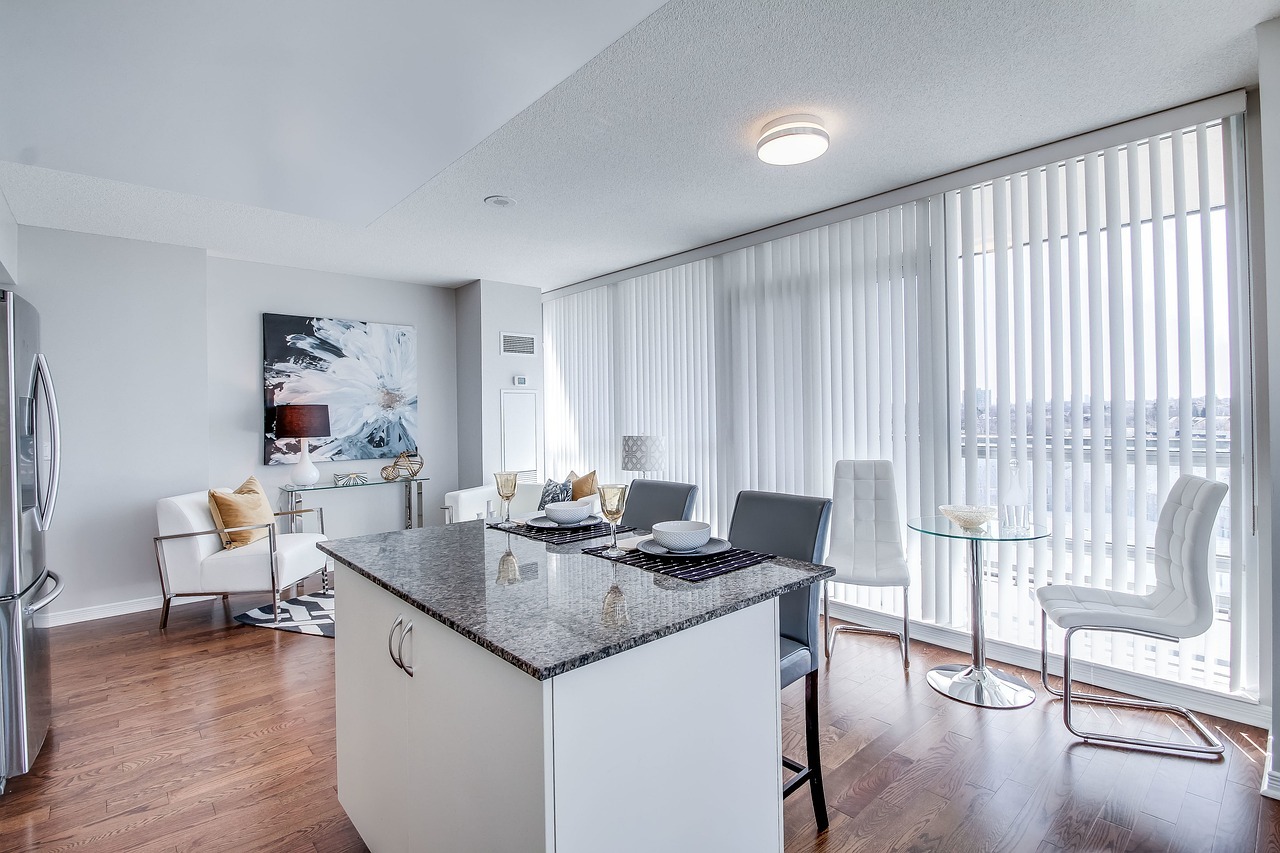 Airbnb unit with kitchen island and chairs protected by short term rental insurance in Oakville