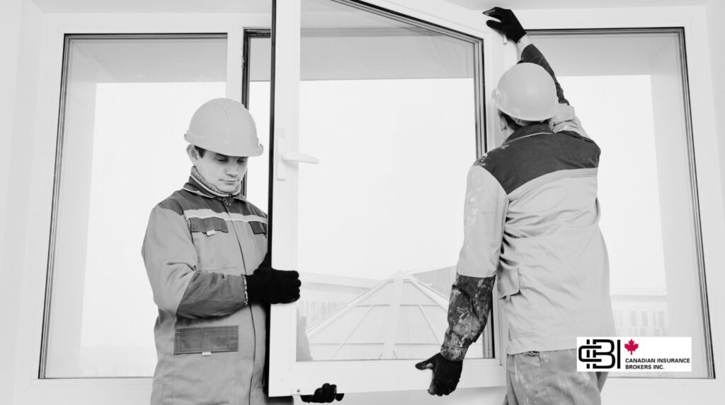Two window installers fitting a large window frame during a residential installation in Oakville
