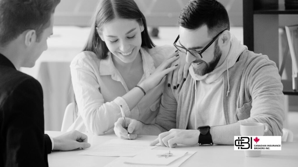 a couple signing a certificate of insurance in oakville.