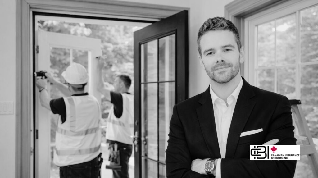 James Inwood standing in a residential property with window and door installers working in the background in Oakville, Ontario