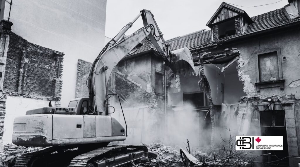 Alt text: Excavator performing structural demolition on a building in Ontario, illustrating demolition contractor insurance risk