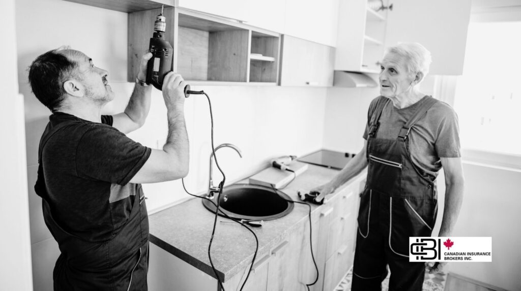 Handyman installing kitchen cabinets in an Oakville home while homeowner observes the work