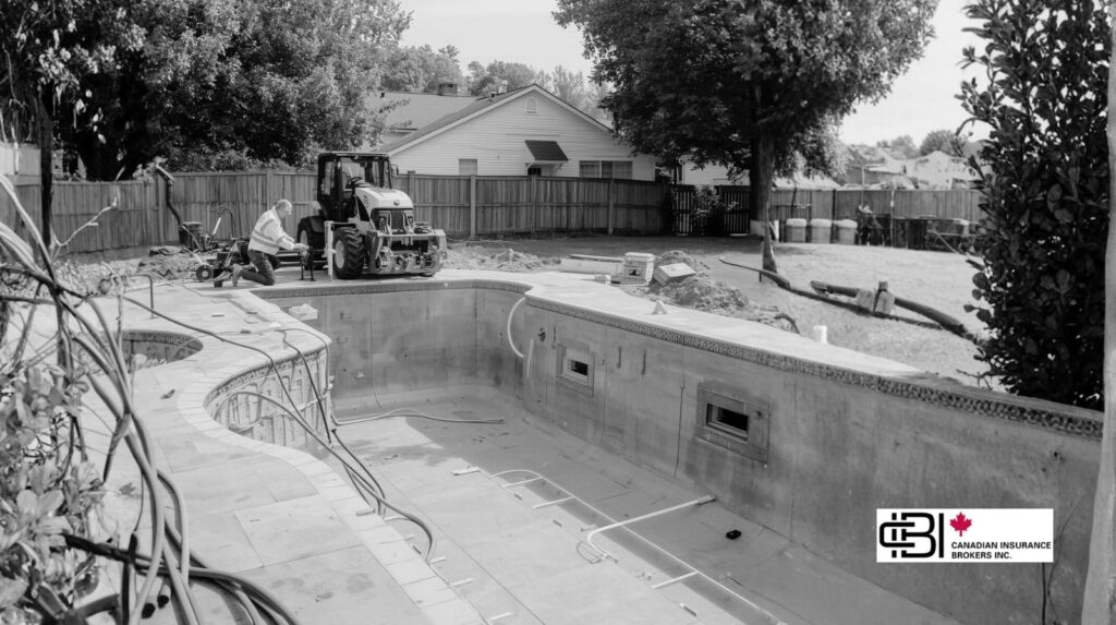 James Inwood overseeing a residential pool construction site with insured pool installers