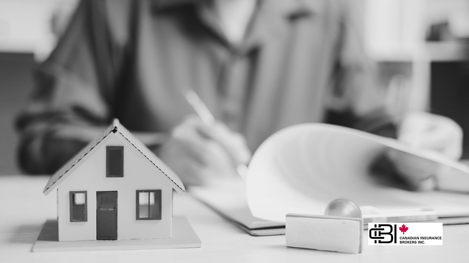 alt text: Home appraisal documents and property model for insurance review in Ontario