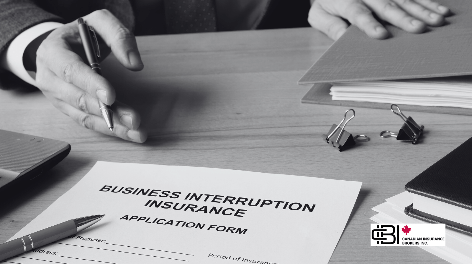 Business interruption insurance application form on desk