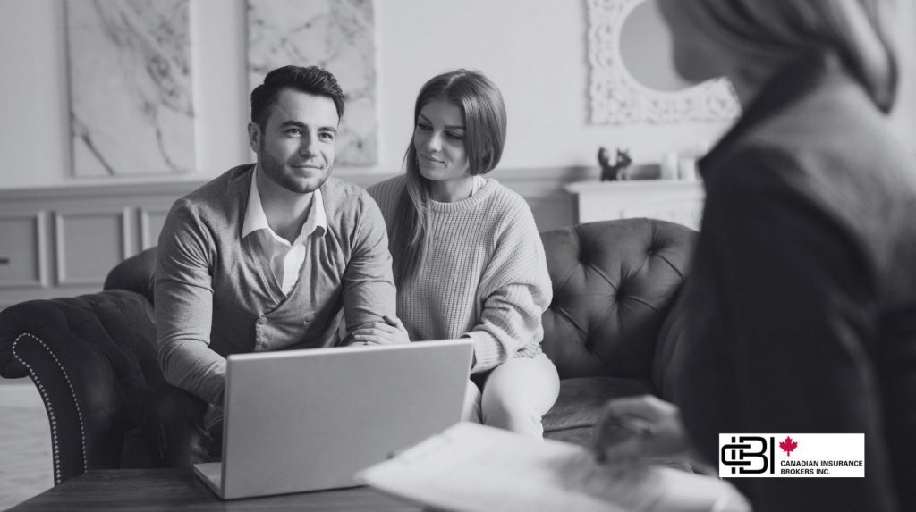 Young couple reviewing joint-life insurance options with financial advisor in Ontario