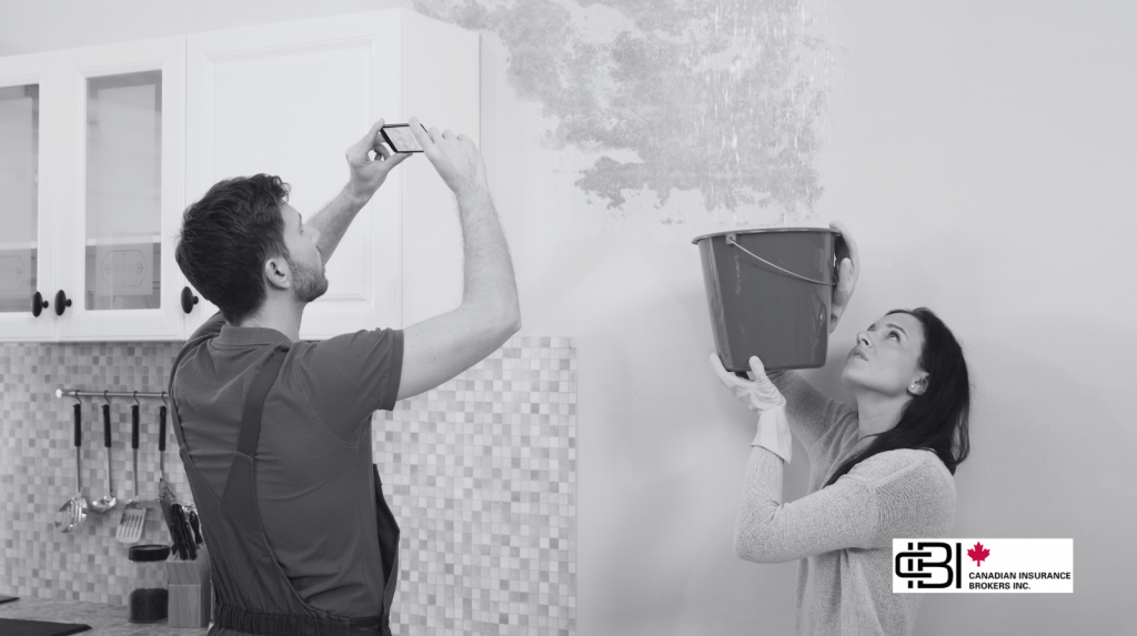 Homeowner documenting wall leak and mold for water damage insurance assessment