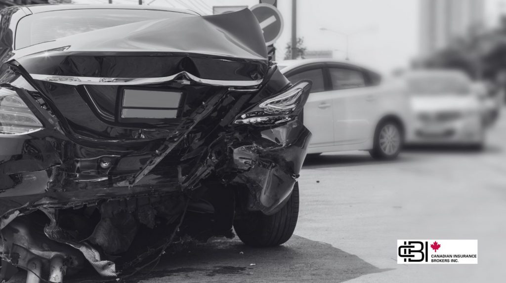 Severely damaged rear bumper after a traffic collision highlighting why Accident Forgiveness is valuable for drivers