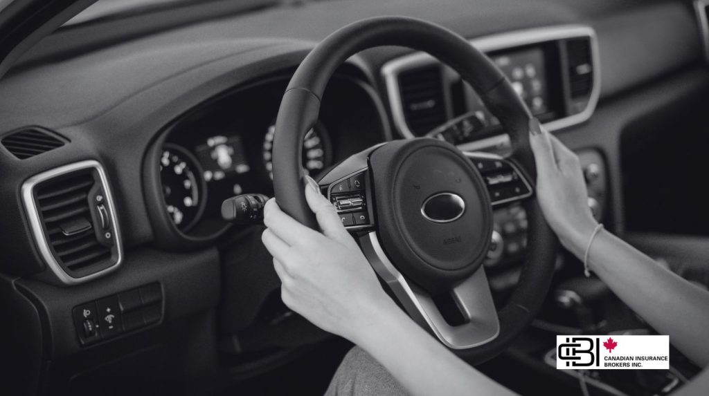 Close-up of hands on a steering wheel inside a car, illustrating G2 insurance coverage for everyday driving situations.