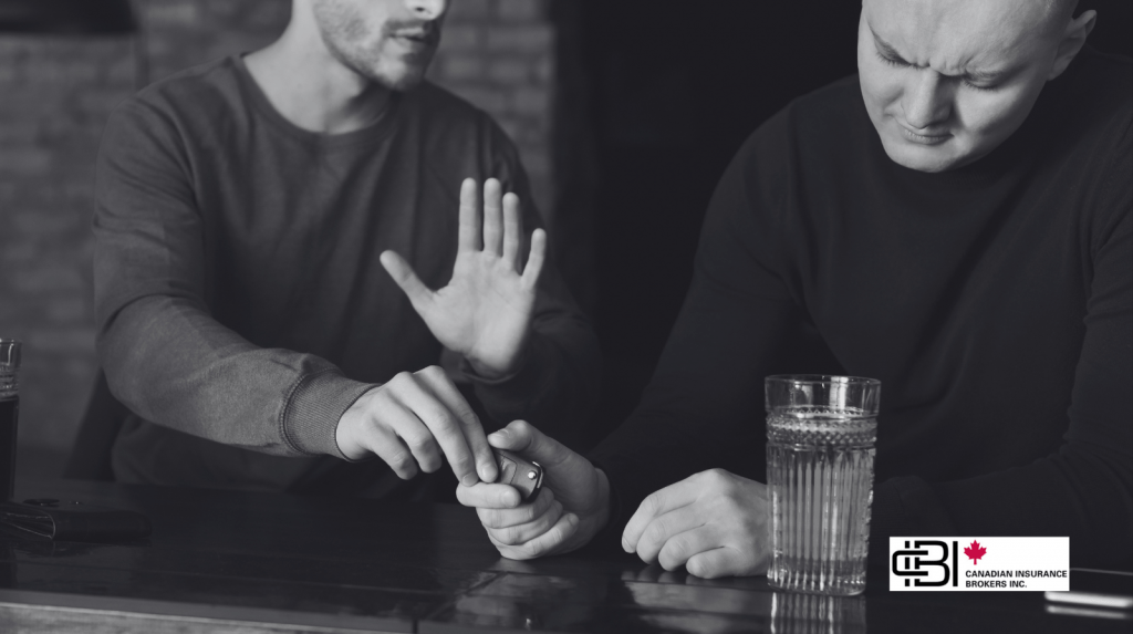 Person stopping a friend from driving after drinking at a bar, illustrating prevention of impaired driving Ontario.