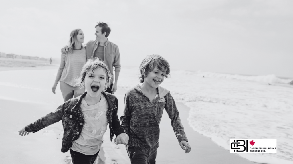 Family walking on a beach, representing life insurance premium planning and long-term financial protection.
