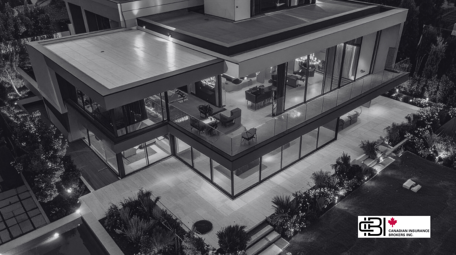 large contemporary luxury property at night, showcasing architecture typical of high value home ontario properties.