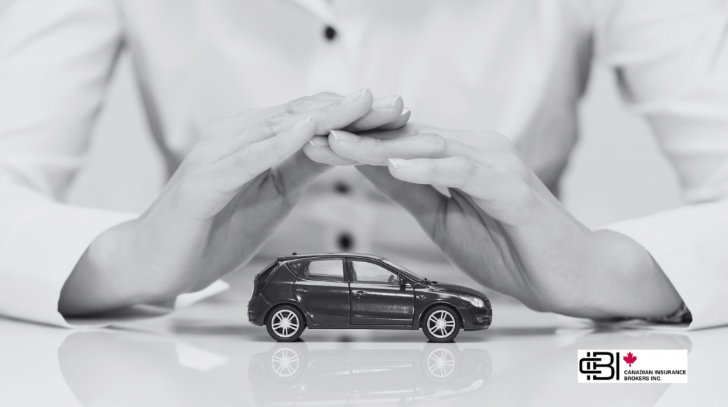 Hands shielding a model car symbolizing comprehensive car insurance in Oakville against theft, vandalism, and weather damage
