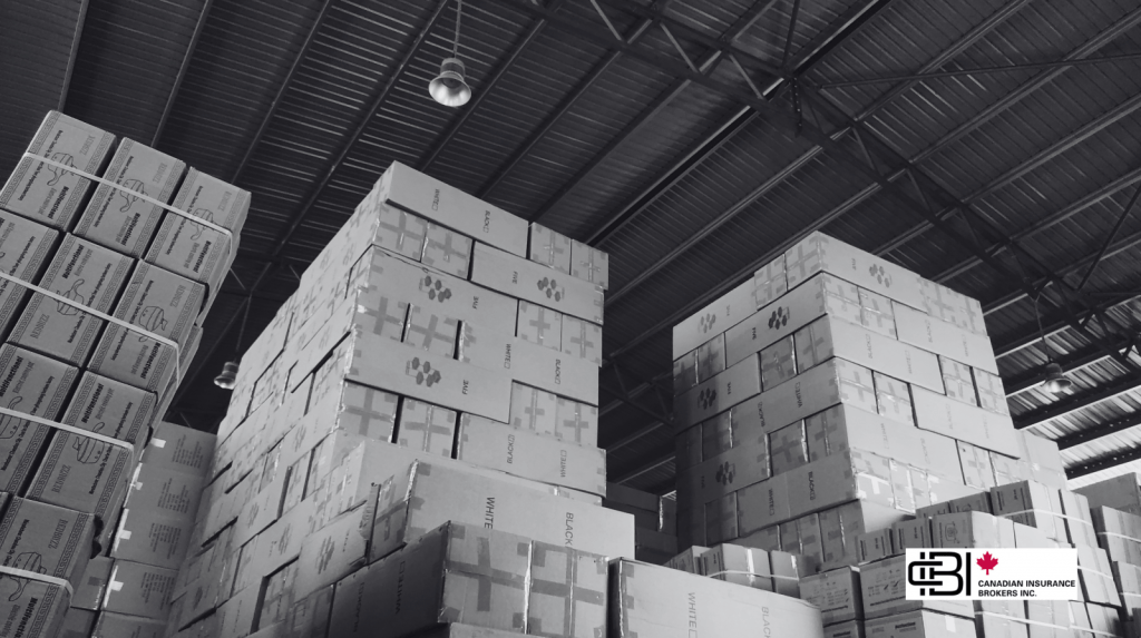 Large warehouse filled with stacked inventory and shipping cartons, highlighting cargo insurance in Ontario for stored and transported goods