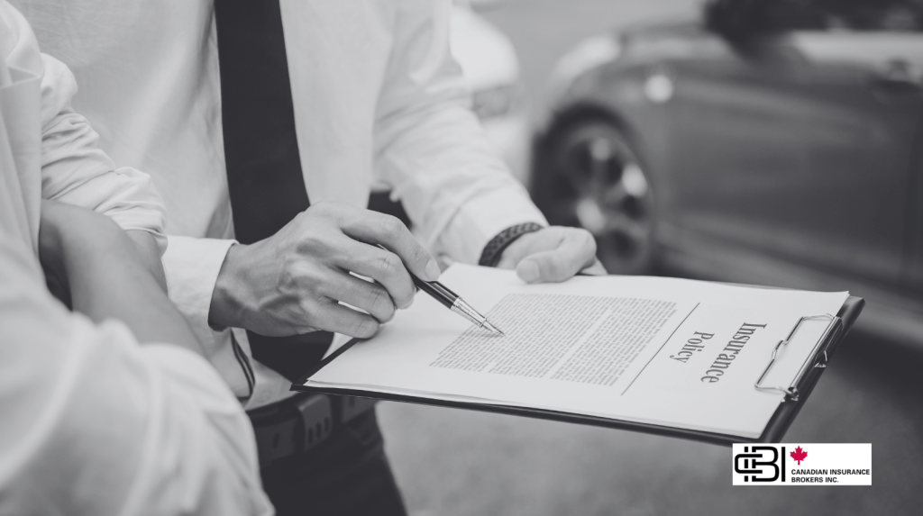 Insurance advisor reviewing an automobile insurance policy with a client, illustrating Ontario Auto Insurance Reform 2026 and OAP 1 policy changes before policy renewal