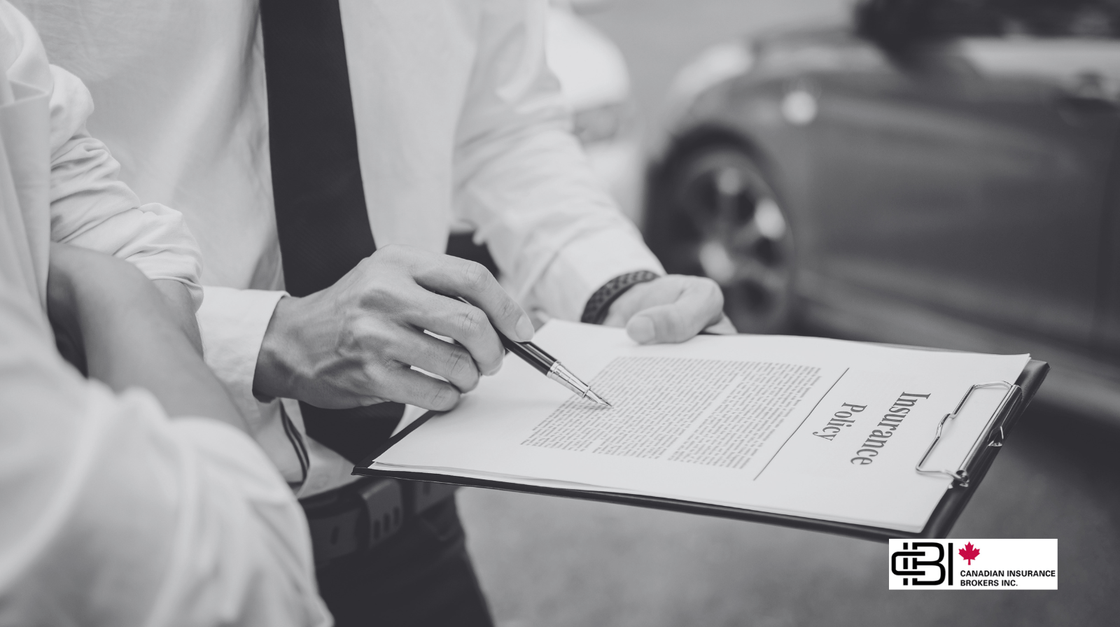 Insurance advisor reviewing an automobile insurance policy with a client, illustrating Ontario Auto Insurance Reform 2026 and OAP 1 policy changes before policy renewal