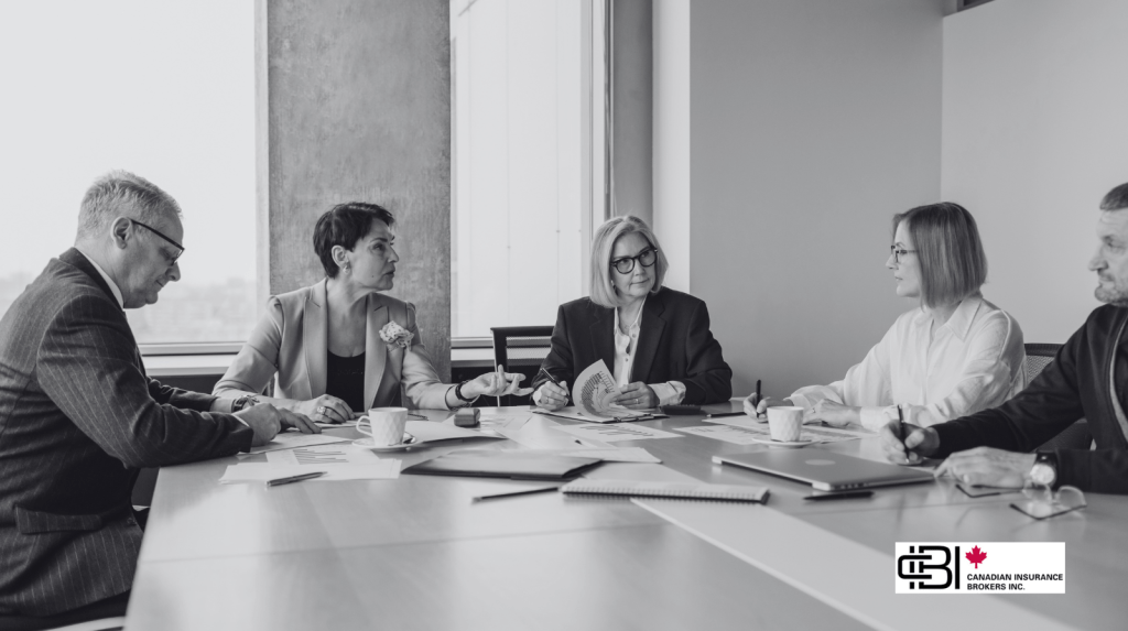 Executive team discussing governance and strategy with Directors and Officers Insurance Ontario protection.