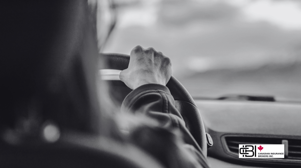 Driver holding the steering wheel while traveling on an Ontario roadway, representing Ontario Auto Insurance Reform 2026 and the importance of understanding OAP 1 policy changes