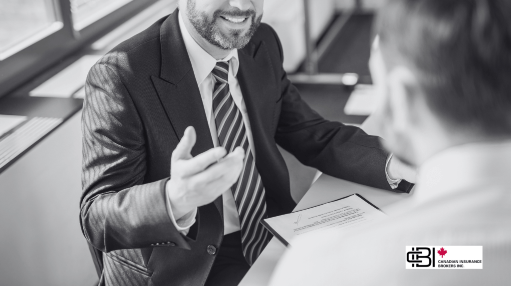 Business consultant discussing professional liability insurance requirements with a client during an office meeting